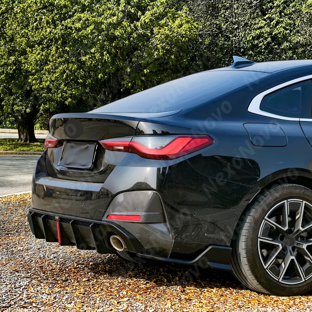 Dynamic shot of BMW G26 with VTEN rear kit in garage
