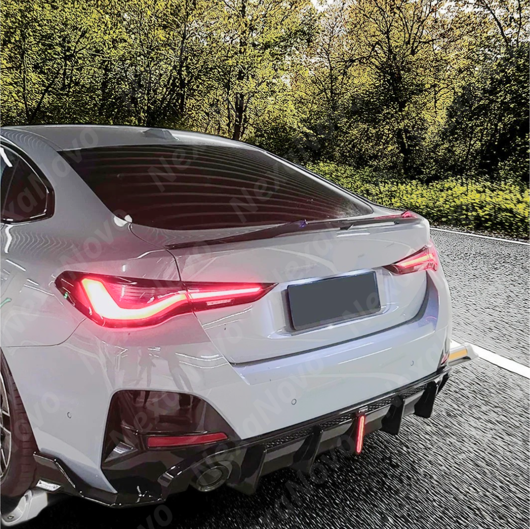 Dynamic shot of BMW G26 with VTEN rear splitters in garage