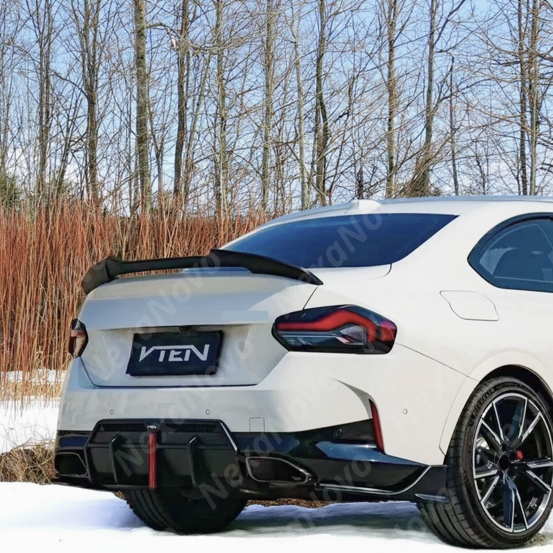 Glossy black VTEN rear diffuser on a white BMW G42