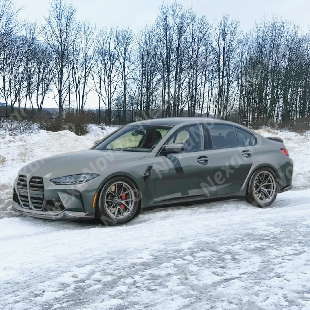 Angled front-to-rear view of G80 M3 showing NexaNovo front lip integration