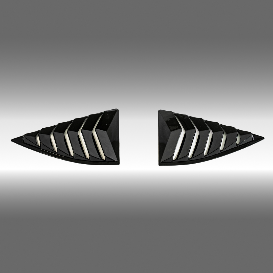 Gloss black rear window louver sunshade installed on a 2010 Chevrolet Camaro