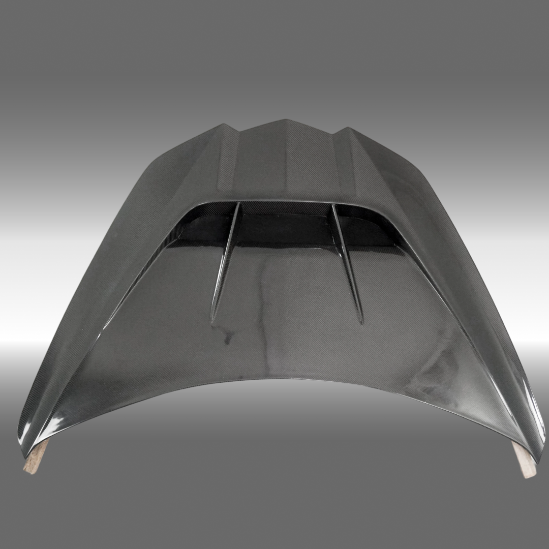 NexaNovo carbon fiber hood on a grey Chevrolet Corvette C8