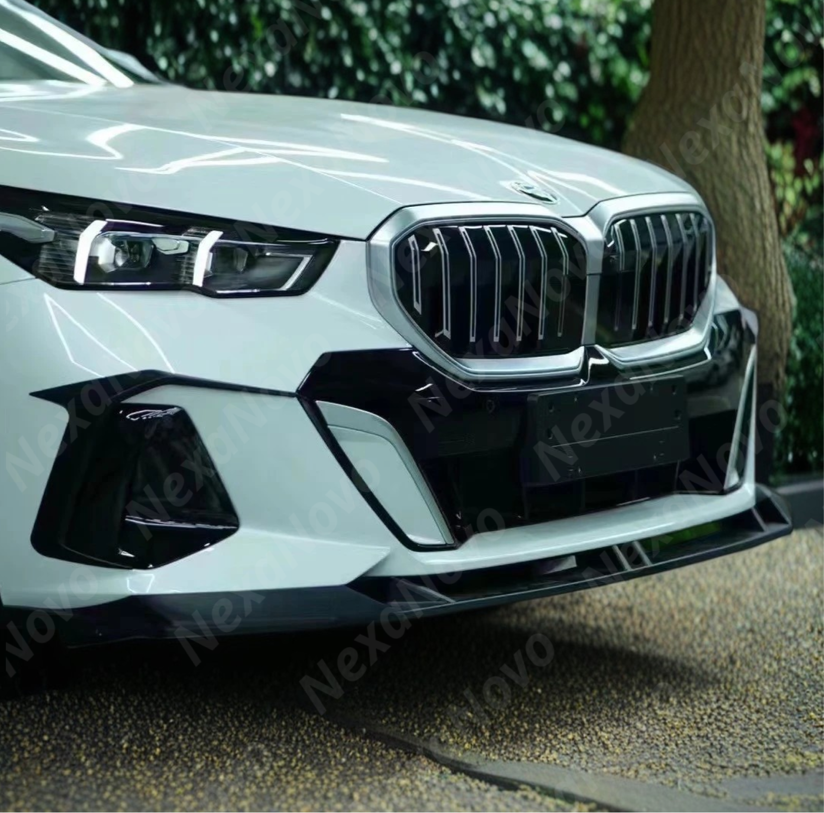 NexaNovo gloss black V style front spoiler lip for BMW M560e xDrive 2024-2025.