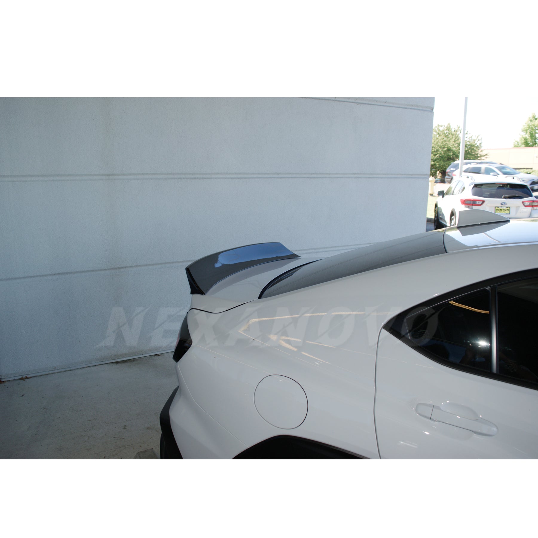 Detailed perspective focusing on the contours and design of the Paint Matched Duckbill Rear Spoiler on the WRX STI 2022-2024.