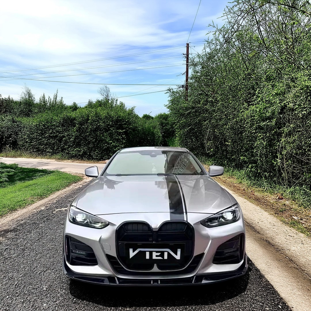 Carbon fiber NaxaNovo VTEN front lip precisely fitted to a BMW G23 4 Series Convertible.