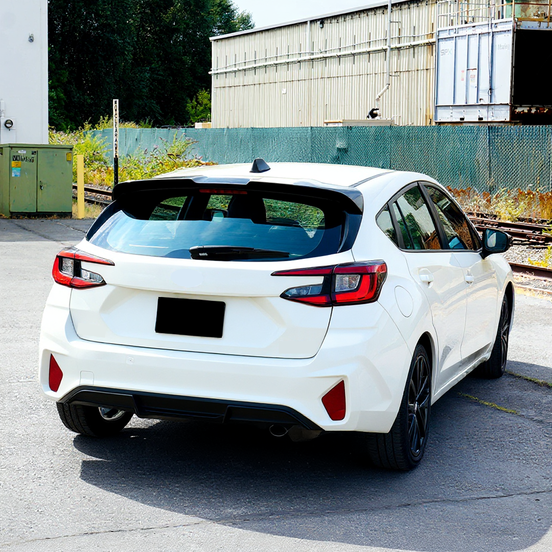 Rear spoiler wing installation in progress on Subaru Impreza RS