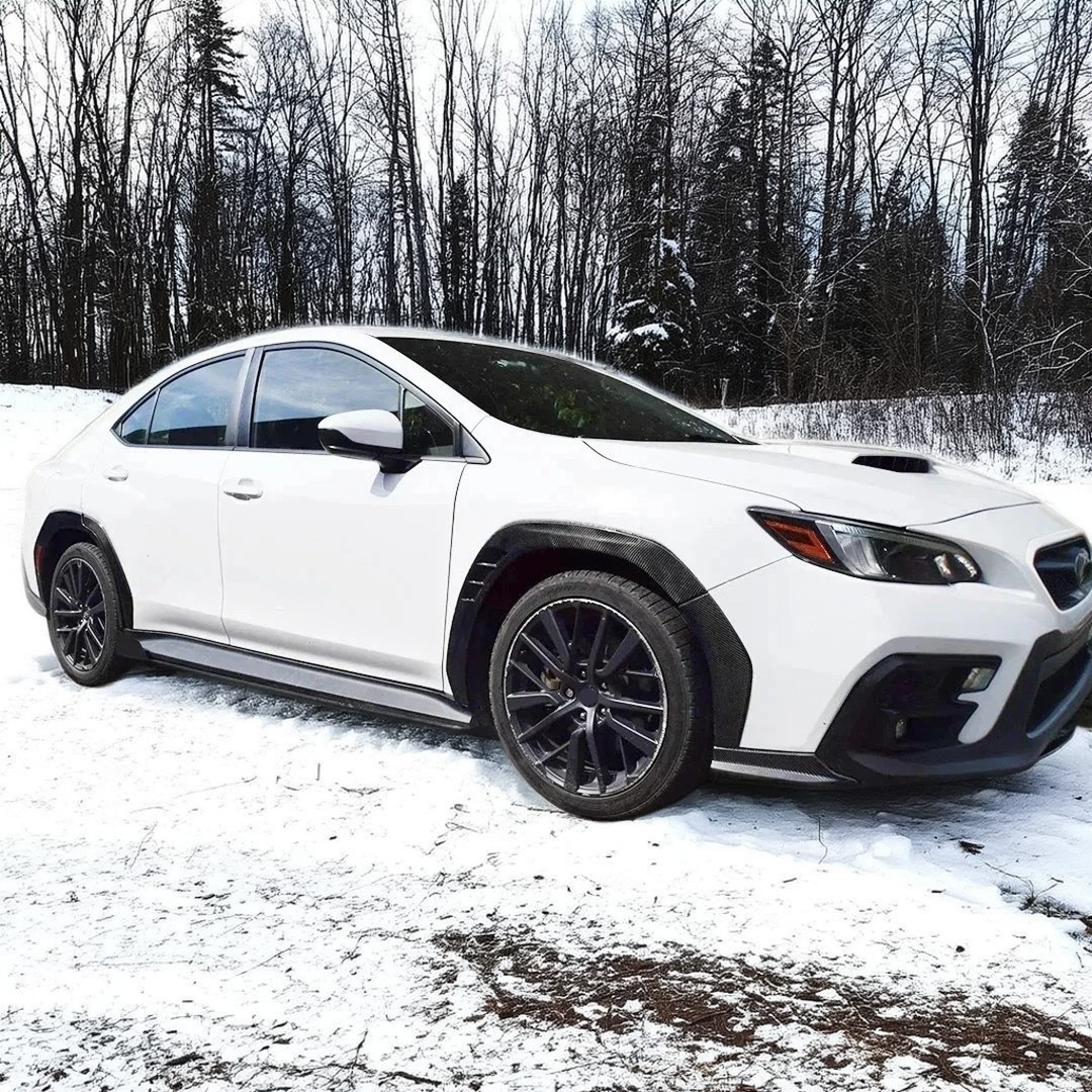 NexaNovo real carbon fiber wide body fender flares installed on a Subaru WRX VB, giving it a more aggressive stance