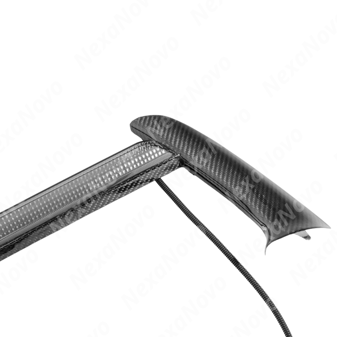 Low angle view emphasizing NexaNovo carbon fiber LED DRL bezel on C8
