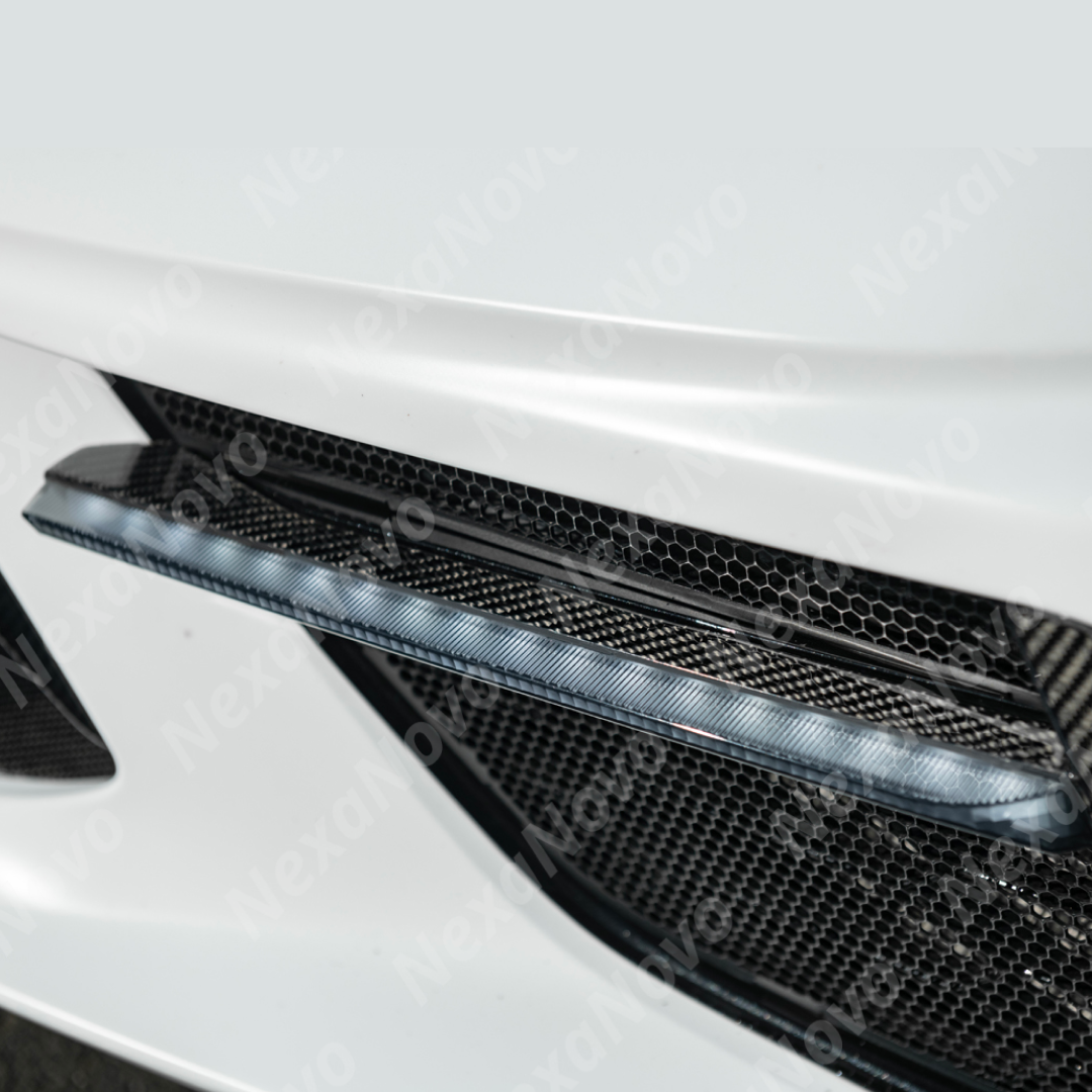 NexaNovo carbon fiber sequential LED DRL light bar bezel insert on a white C8 Corvette