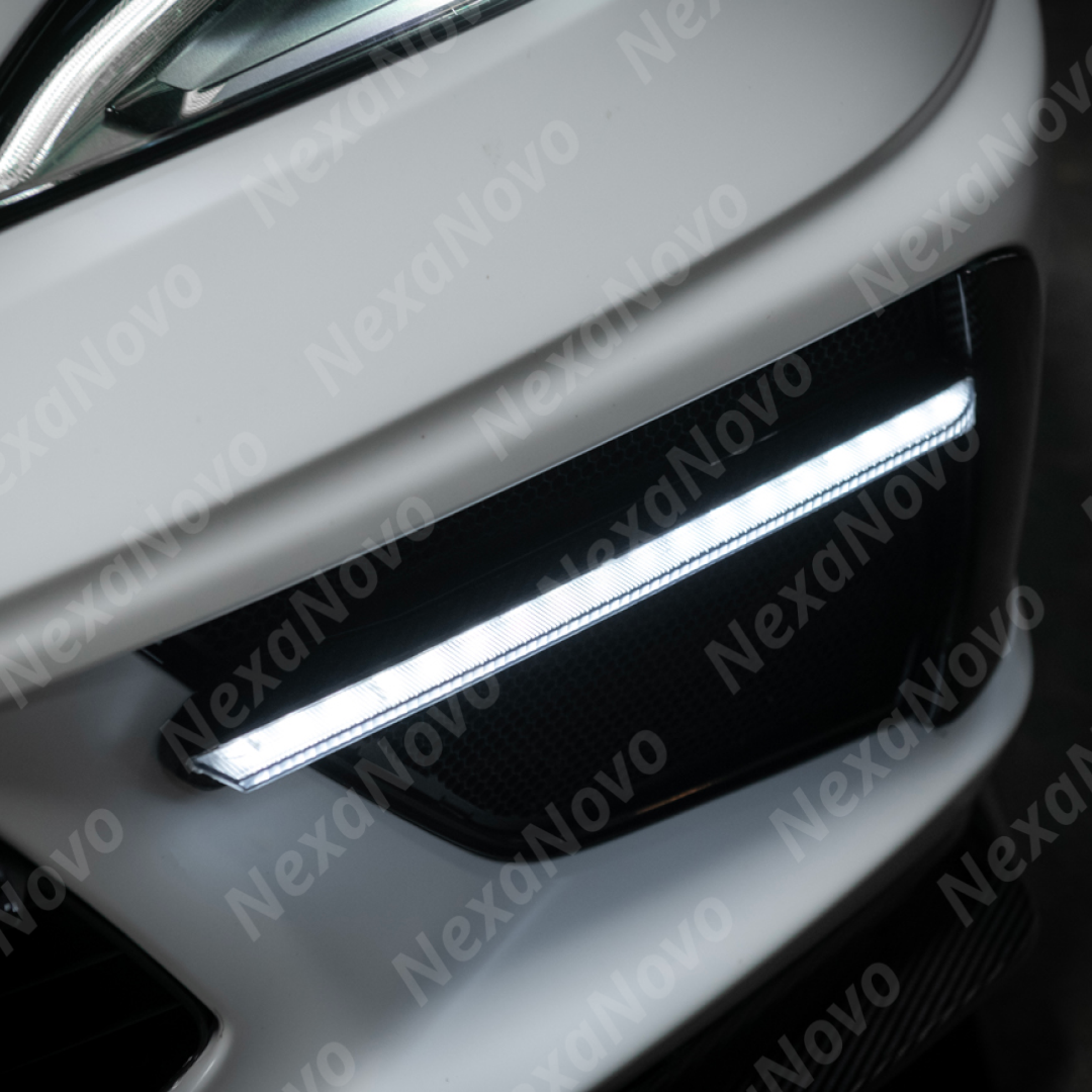Corvette C8 in motion with illuminated NexaNovo carbon fiber LED DRL light bar bezel