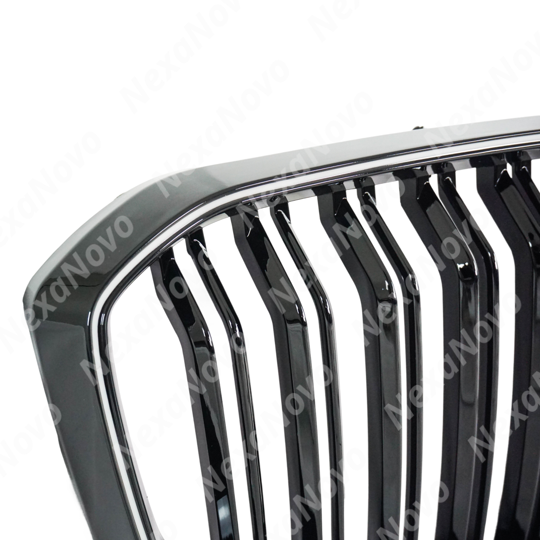 Low angle view emphasizing the NexaNovo glossy black LED grills on X5 G05