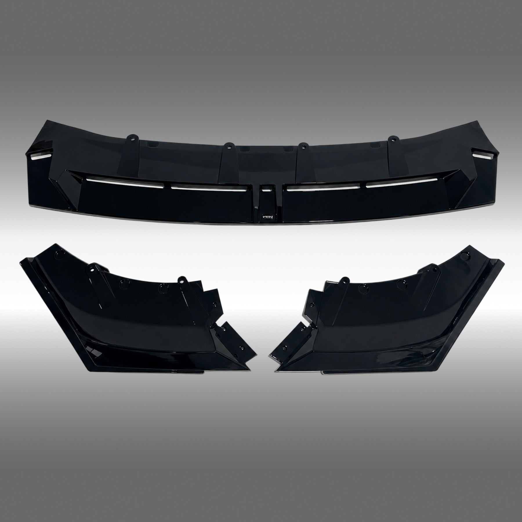 NexaNovo VTEN style gloss black front lip splitter installed on a 2024 BMW 5 Series G60 sedan