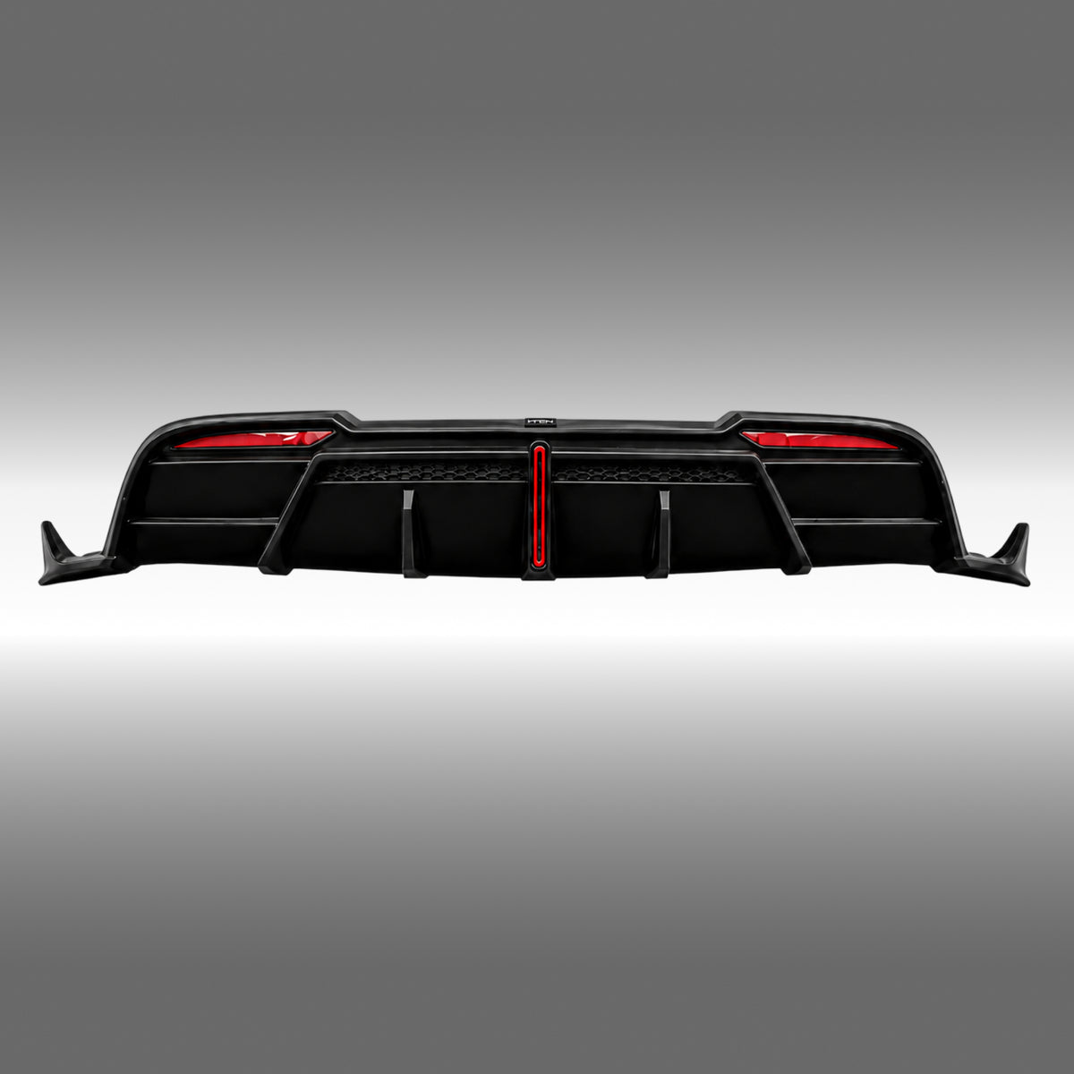 NexaNovo VTEN style gloss black rear diffuser with integrated LED light installed on a Tesla Model Y