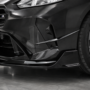 Direct front-facing view highlighting the aggressive corner dive planes by NexaNovo on the F74 front bumper