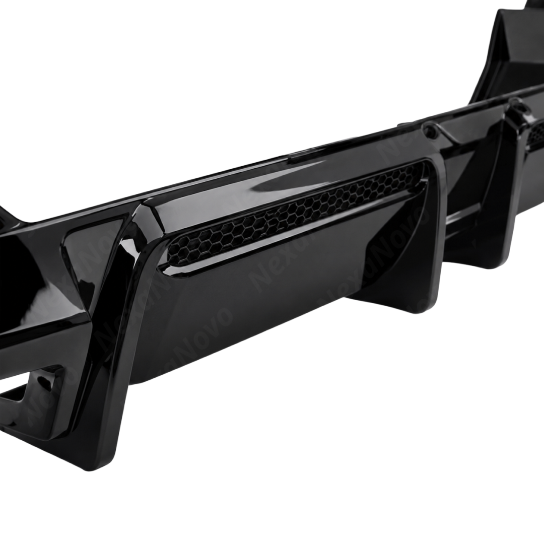 High-contrast stance of the NexaNovo VTEN gloss black rear diffuser accenting a Brooklyn Grey 2025 BMW G60