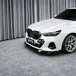 Detailed close-up of the mirror-finish gloss black clear coat on the NexaNovo front lip splitter