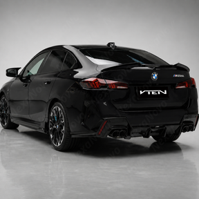 Direct rear view highlighting the elevated GT-style silhouette of the NexaNovo VTEN wing on the F74 trunk lid