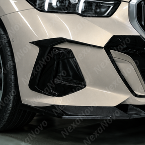 Close-up view showing the mirror-finish gloss black clear coat on the NexaNovo front bumper canards