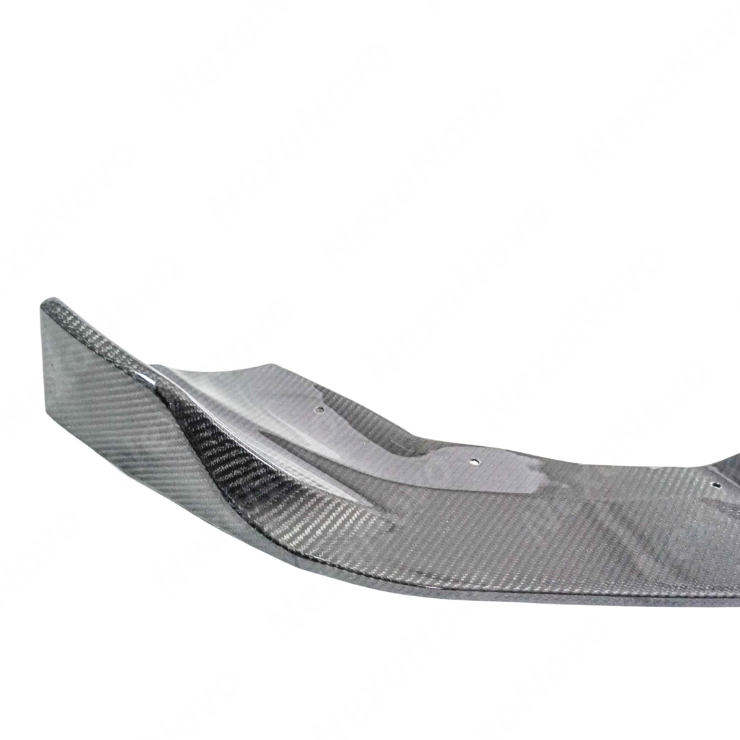 A 2021 BMW F87 M2 with the NexaNovo CS Style carbon fiber bumper cover and lip installed