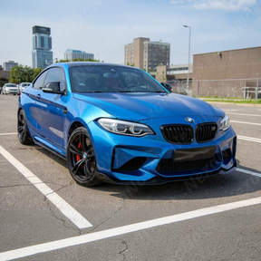 The uninstalled NexaNovo CS Style carbon fiber front bumper cover and body kit components