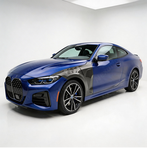 2022 BMW 4 Series in motion highlighting the aerodynamic profile of the NexaNovo carbon trim