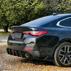 Dynamic shot of BMW G26 with VTEN rear kit in garage