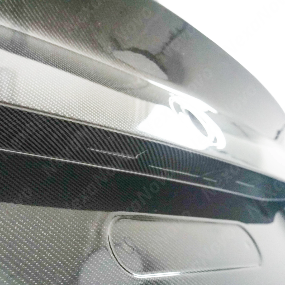 NexaNovo carbon fiber trunk lid integrated on a black BMW G42 2 Series