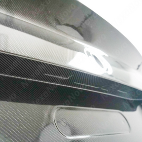 NexaNovo carbon fiber trunk lid integrated on a black BMW G42 2 Series