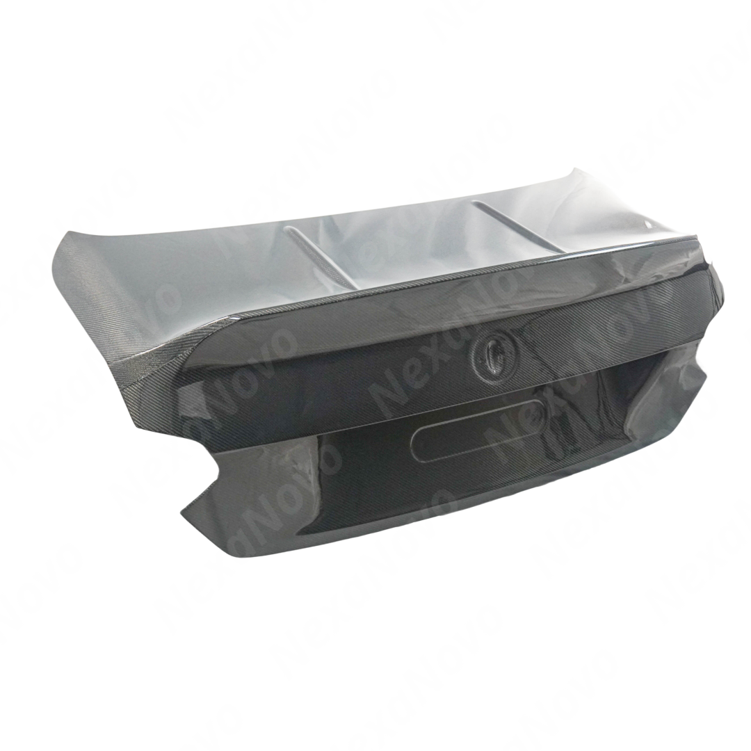 Underside view of uninstalled NexaNovo carbon fiber trunk lid showing mounting points