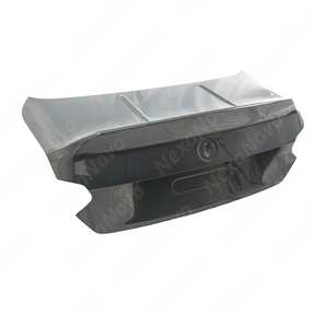 Underside view of uninstalled NexaNovo carbon fiber trunk lid showing mounting points