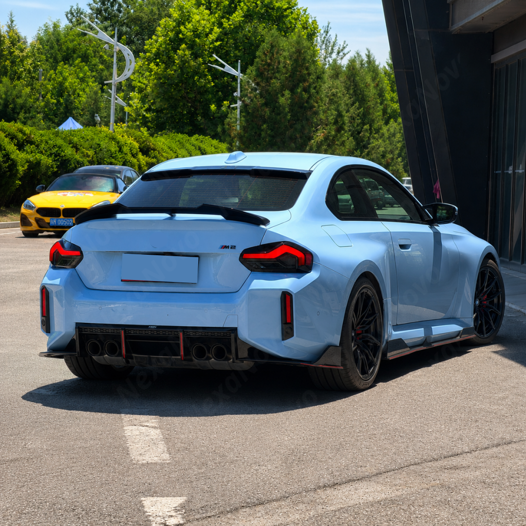 Track-inspired aesthetic of the NexaNovo VTEN gloss black diffuser accenting a Brooklyn Grey Metallic BMW M2