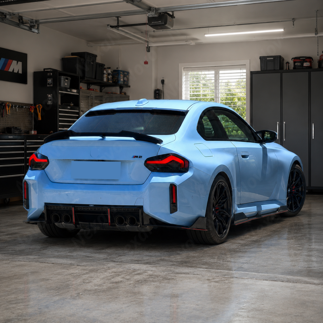 Track-focused stance of the NexaNovo VTEN gloss black spoiler accenting a Brooklyn Grey Metallic BMW M2