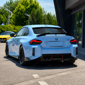 High-gloss black NexaNovo VTEN wing providing a bold contrast on a Zandvoort Blue BMW M2 G87