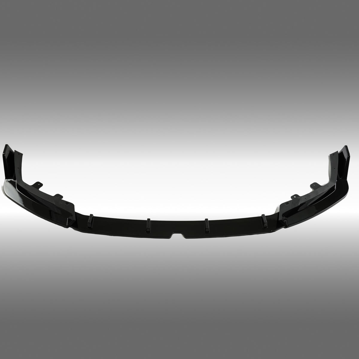 Close-up of the premium mirror-finish gloss black coating on the NexaNovo M5 front splitter