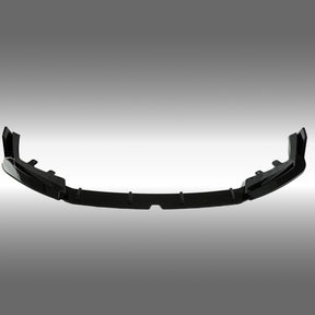 Close-up of the premium mirror-finish gloss black coating on the NexaNovo M5 front splitter