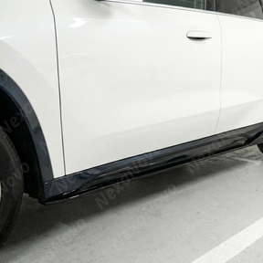 Direct side profile of the NexaNovo gloss black rocker panel extensions for 2023-2025 BMW X1