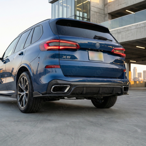 Full rear 3/4 view of a 2024 BMW X5 M60i featuring the NexaNovo real carbon fiber diffuser