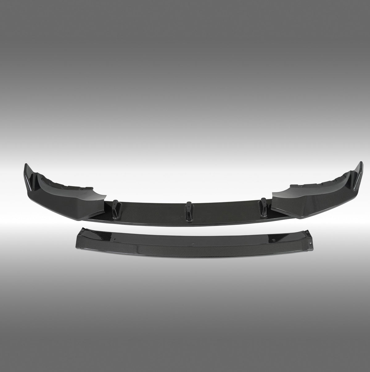 Standalone view of the uninstalled NexaNovo real carbon fiber front bumper lip for BMW X5 G05