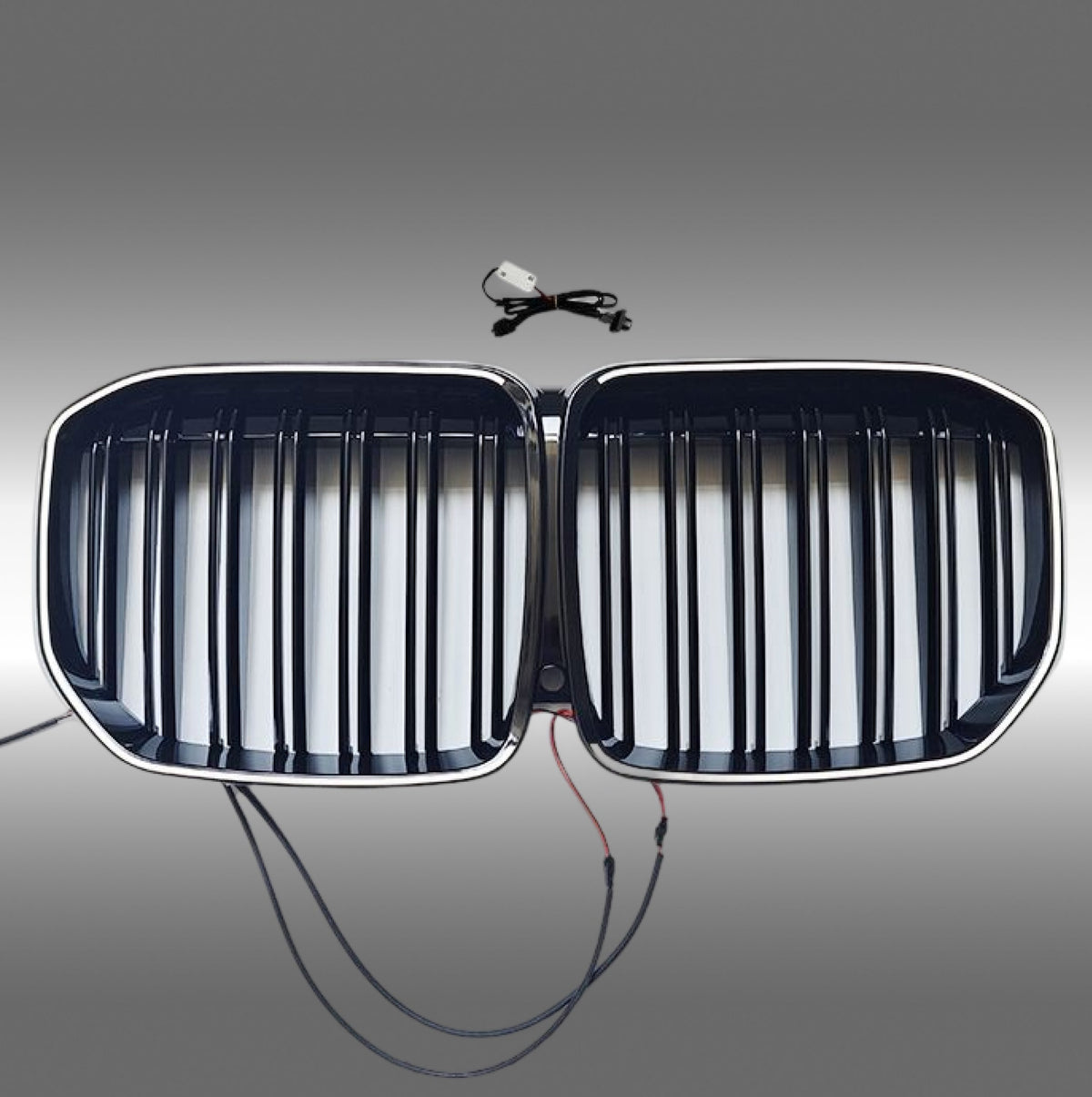 NexaNovo gloss black LED illuminated front kidney grille glowing on a 2019 BMW X7 G07