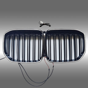 NexaNovo gloss black LED illuminated front kidney grille glowing on a 2019 BMW X7 G07