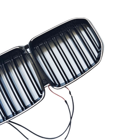 Standalone view of the uninstalled NexaNovo gloss black illuminated grille for BMW X7 G07