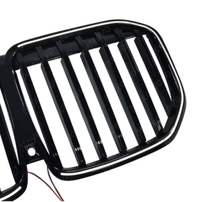 Detailed shot of the UV-resistant high-gloss black coating on the NexaNovo X7 kidney grille