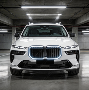 Direct front view of the NexaNovo LCI-style gloss black illuminated grille for 2023-2026 BMW X7
