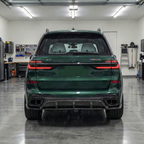 Full rear 3/4 view of a 2024 BMW X7 M60i featuring the NexaNovo real carbon fiber diffuser