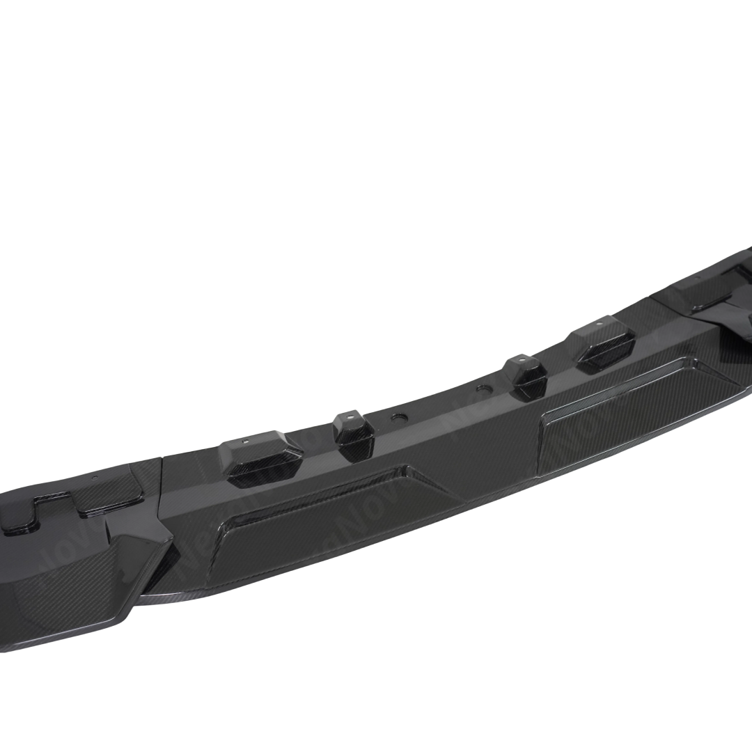 NexaNovo double real carbon fiber splitter acting as a protective barrier for the BMW X7 LCI bumper
