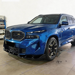 Detailed shot of the UV-resistant high-gloss clear coat on the NexaNovo XM front lip