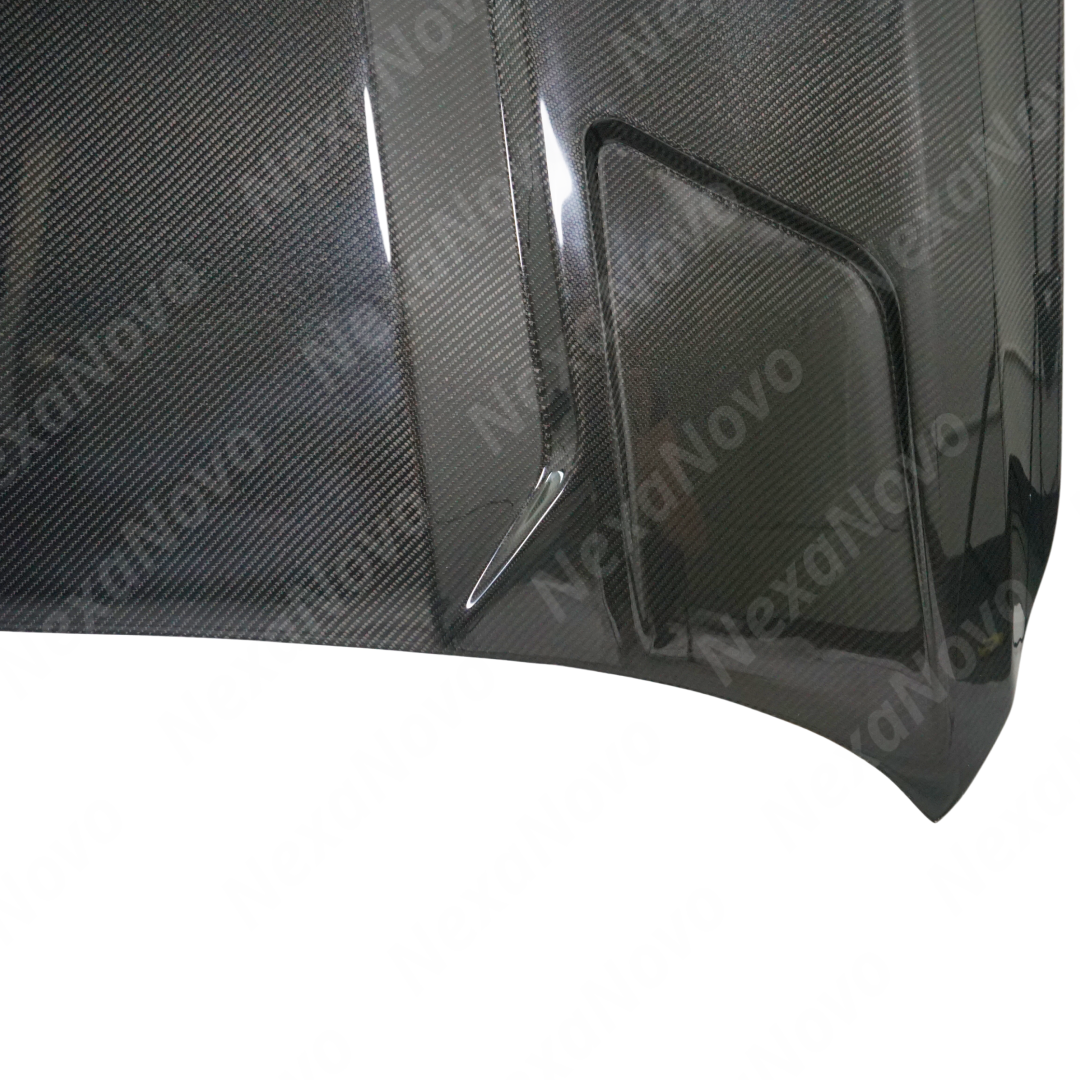 Low angle view emphasizing the NexaNovo carbon fiber hood cover on CT5