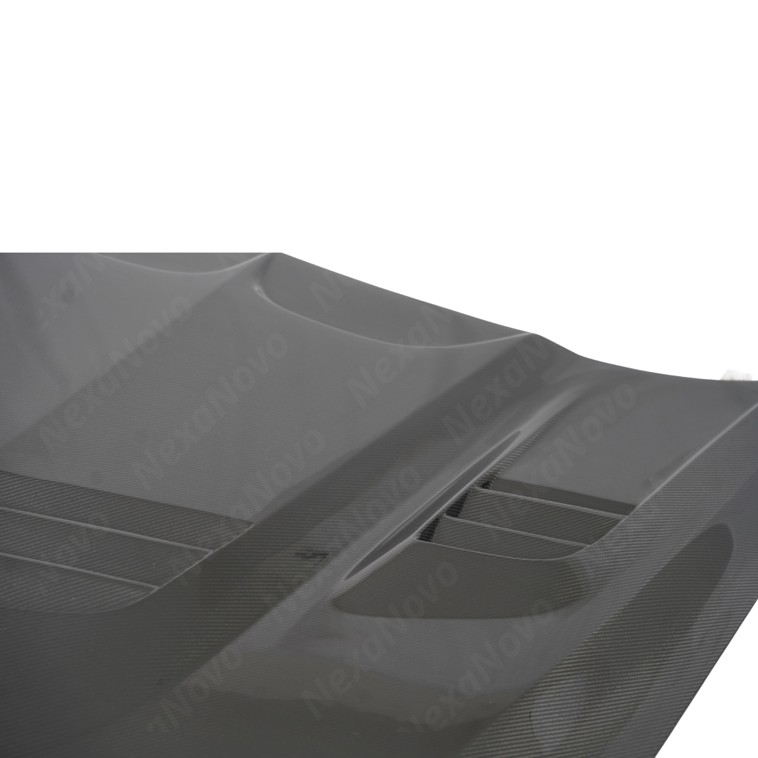 Close-up of the premium NexaNovo 3K twill real carbon fiber weave on the Cadillac CT5 hood