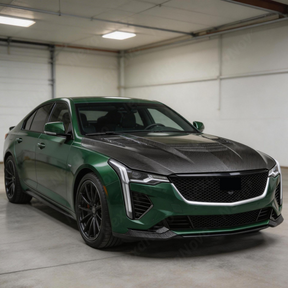 Cadillac CT5 with new NexaNovo real carbon fiber hood parked in a professional detailing bay