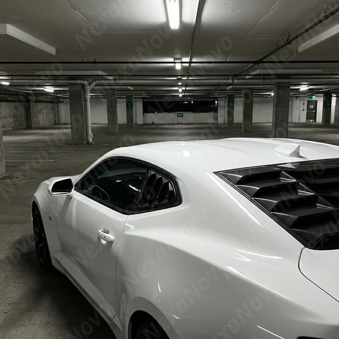 Full side profile of a 2018 Chevrolet Camaro featuring NexaNovo carbon fiber print side quarter window covers